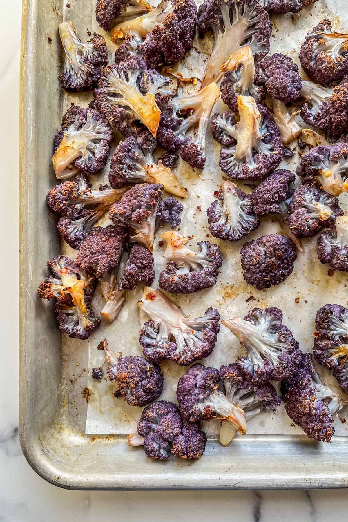 Roasted Purple Cauliflower on a sheet pan.