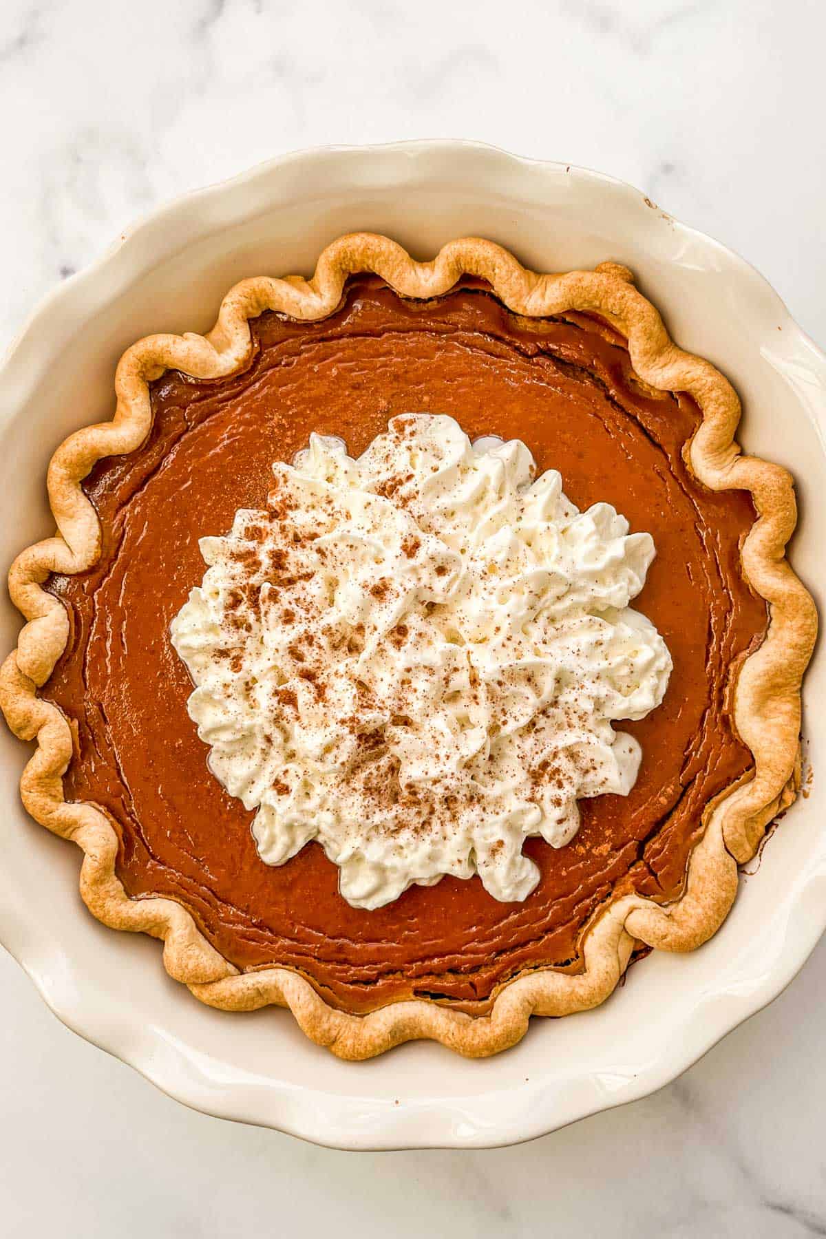 Healthy pumpkin pie in a pie plate.