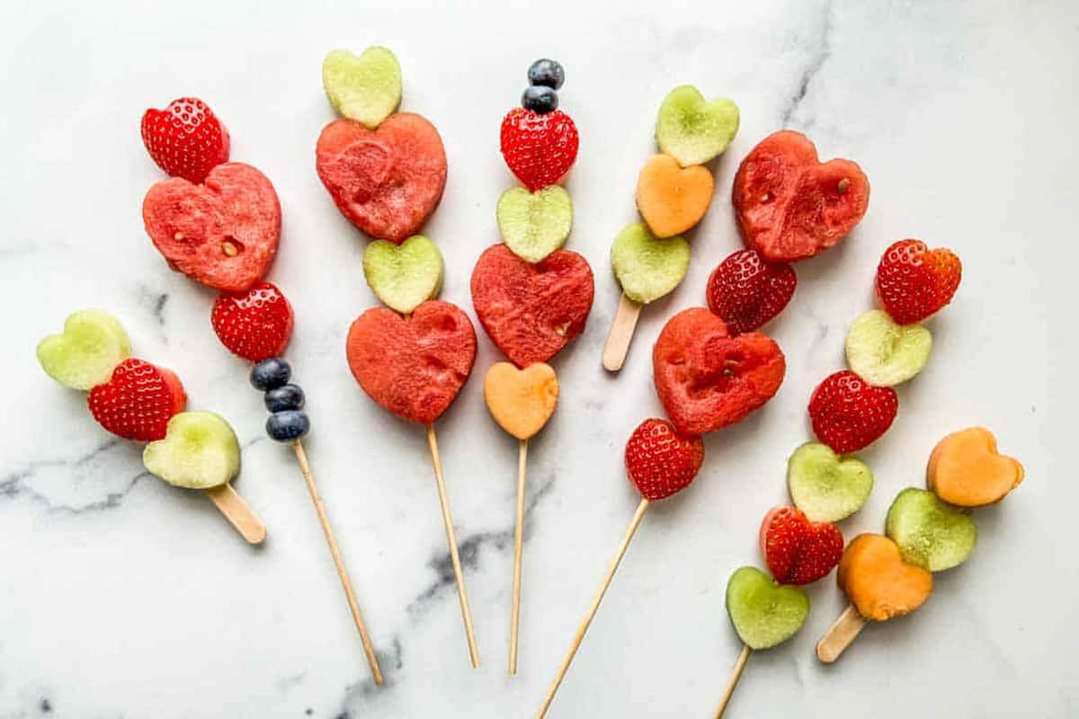 An assortment of Valentine's Day fruit skewers.