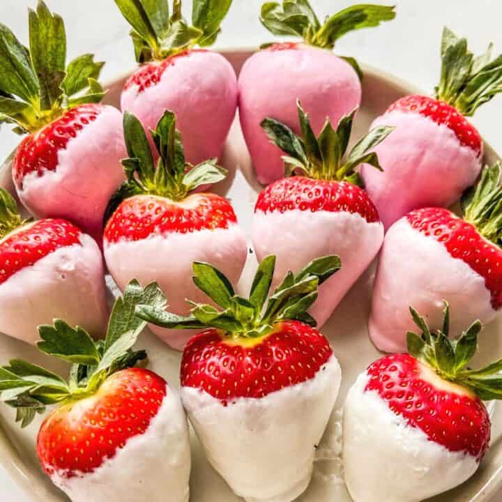 Yogurt covered strawberries in shades of pink.