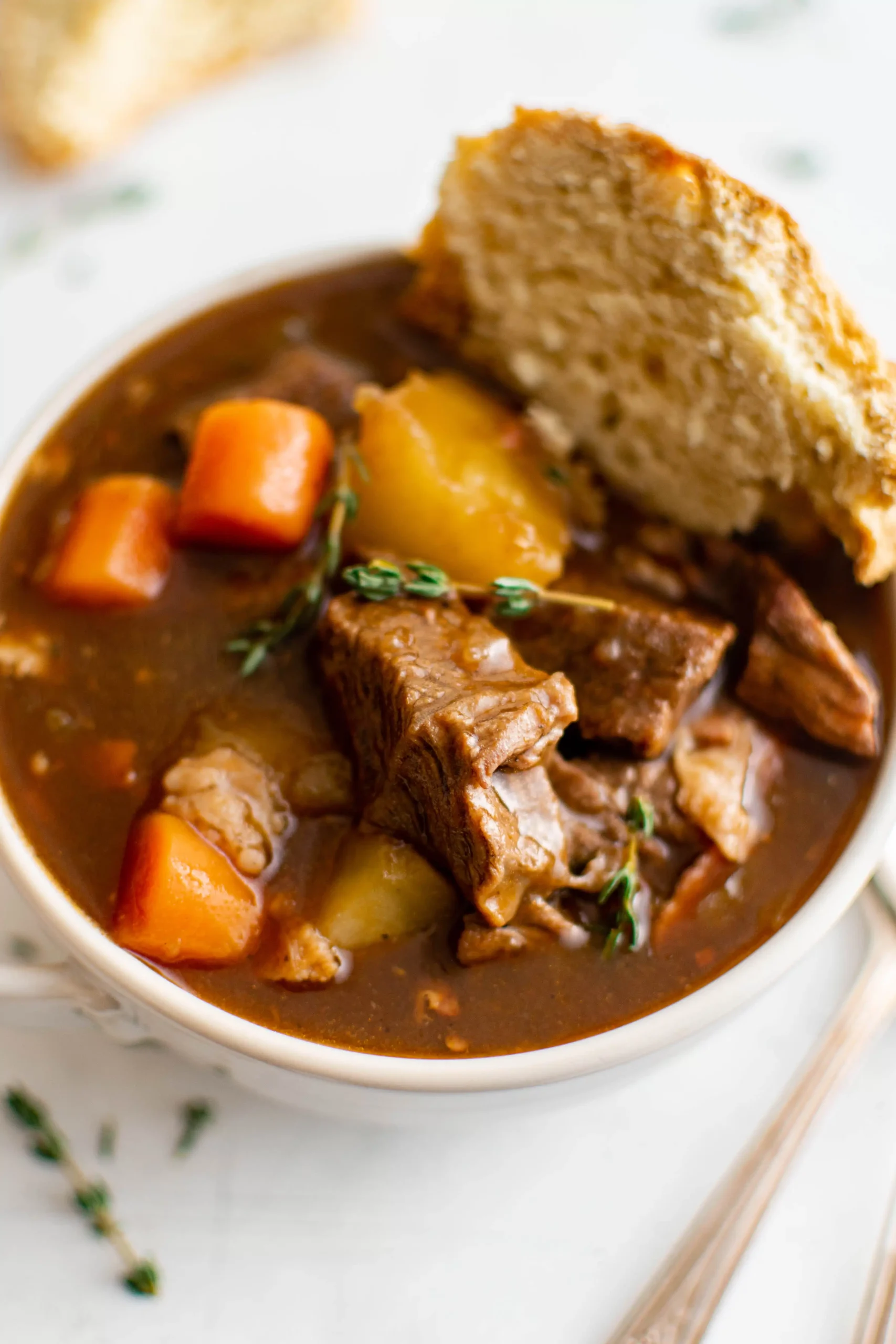 Guinness beef stew in a white bowl.