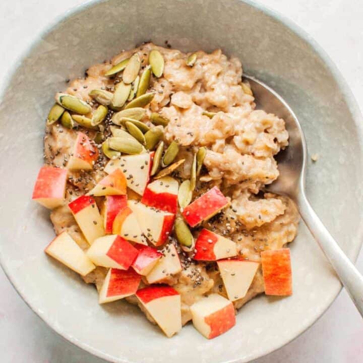 Pumpkin spice oatmeal with apples and pepitas.