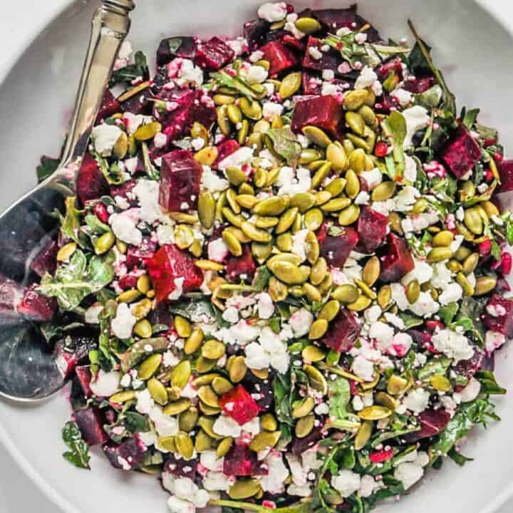 Roasted beet salad with feta in a serving bowl.