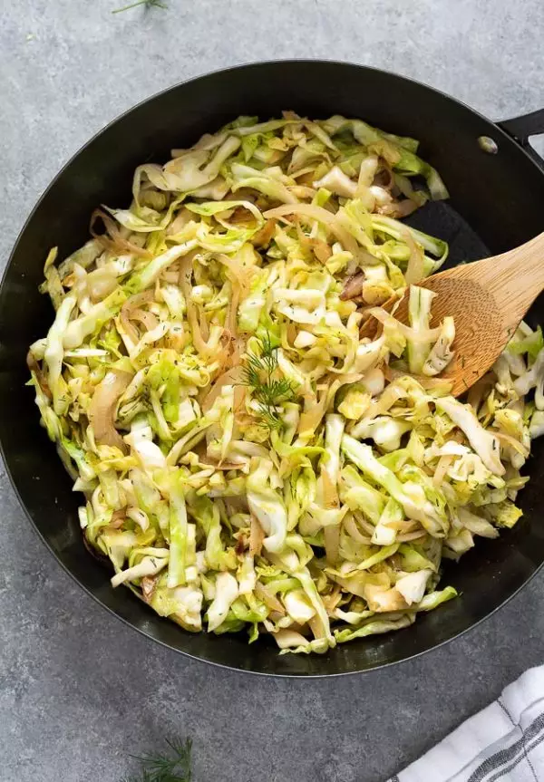 Sauteed cabbage in a skillet.