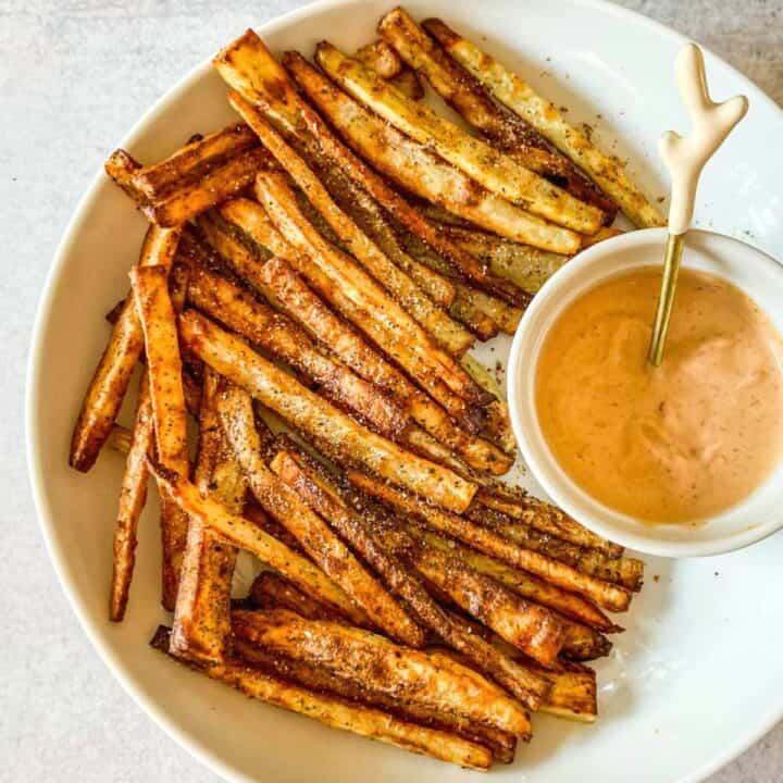 Togarashi fries in a white bowl with spicy mayo.