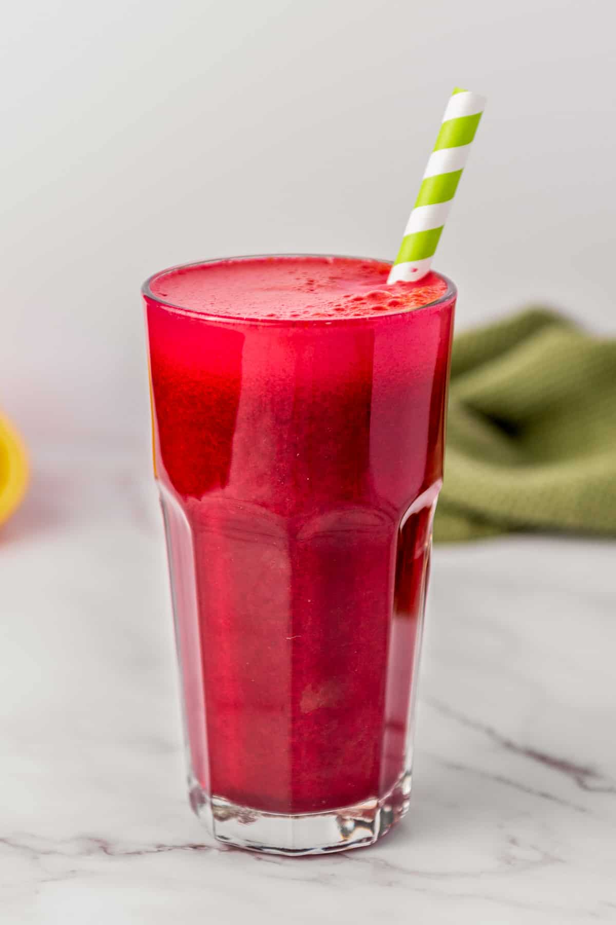 Beet carrot and orange juice in a glass.