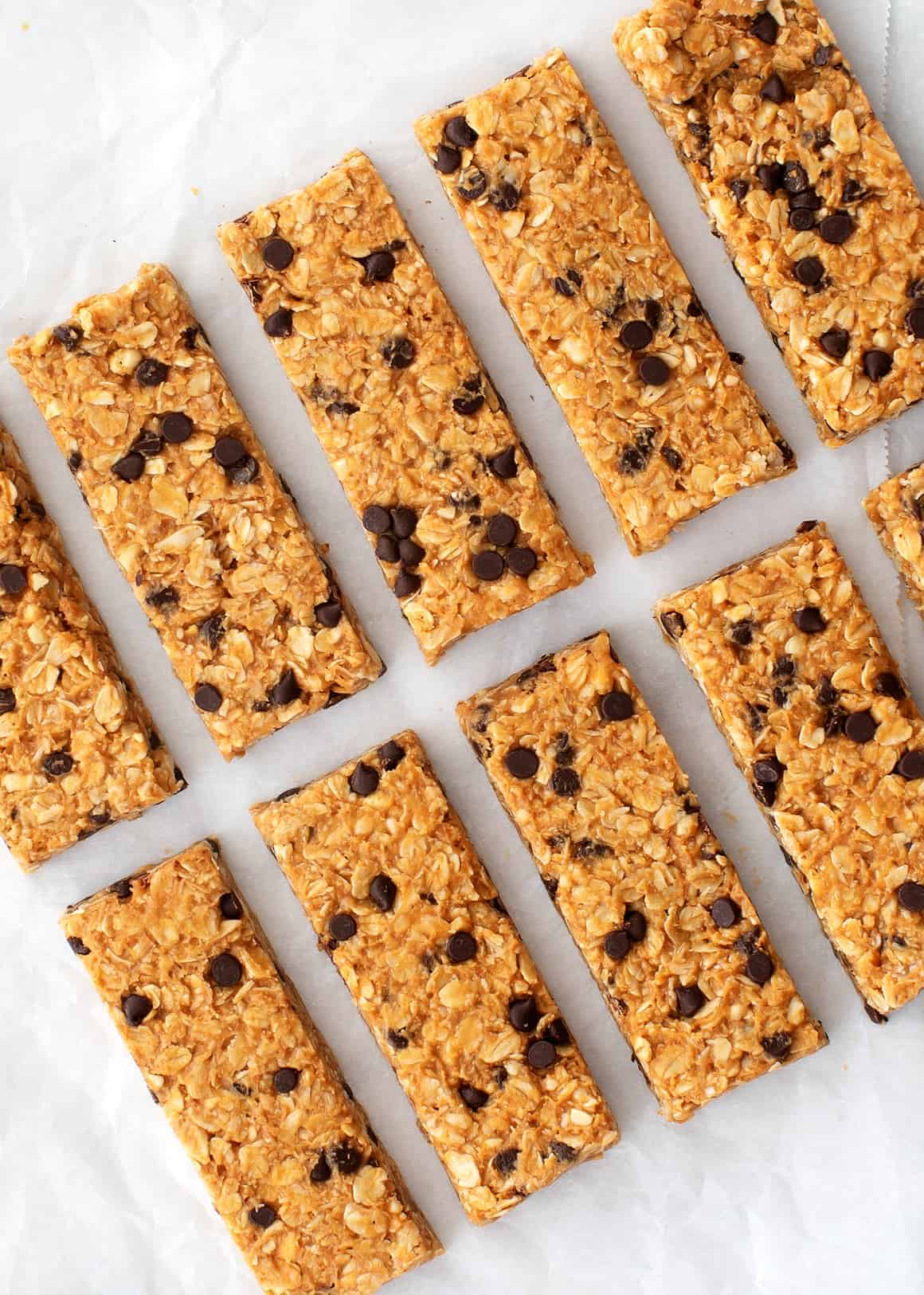 Homemade granola bars on parchment paper.