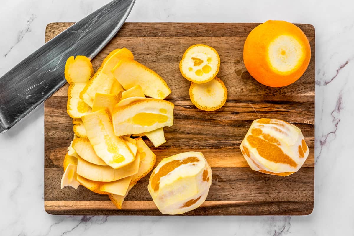 Slicing the skin off an orange.