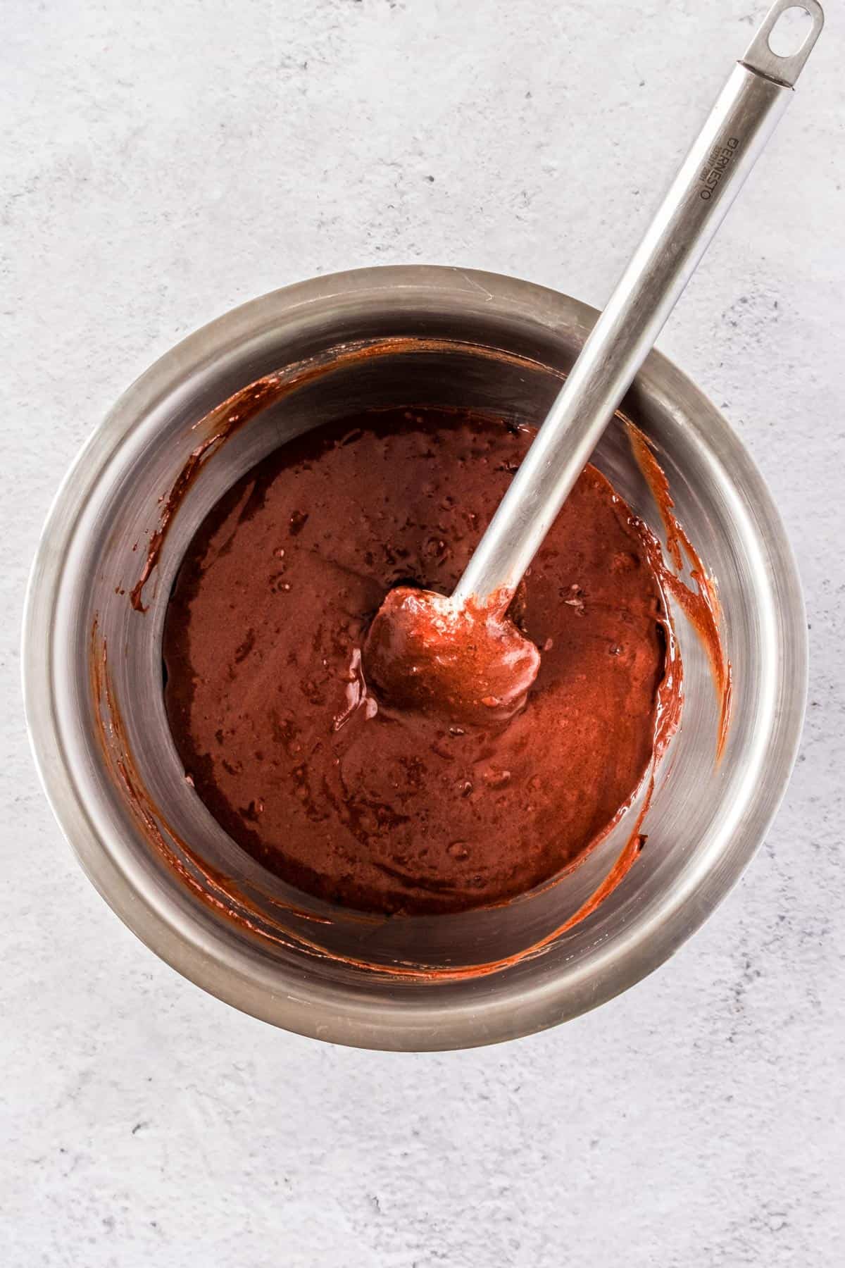 Melted chocolate in a mixing bowl.