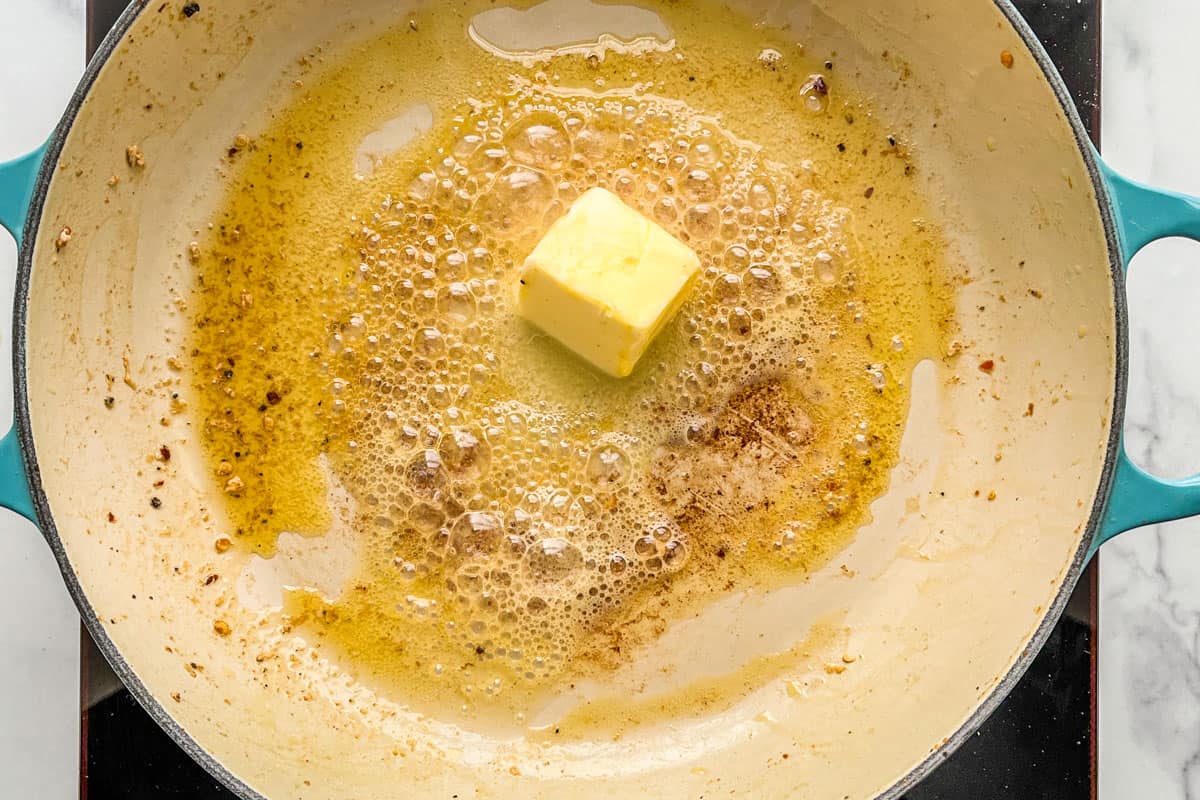 Butter melting in a skillet.