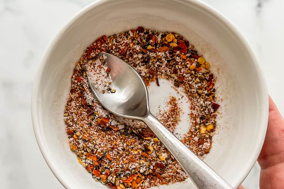 A spice blend in a small white bowl.