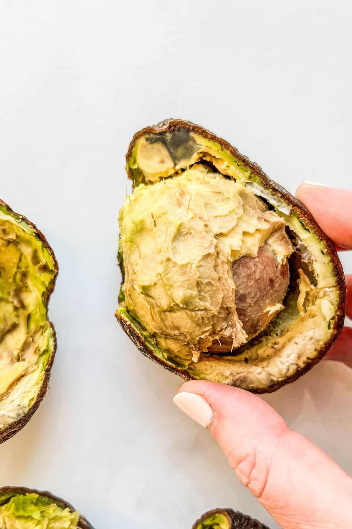 The inside of a molded avocado.