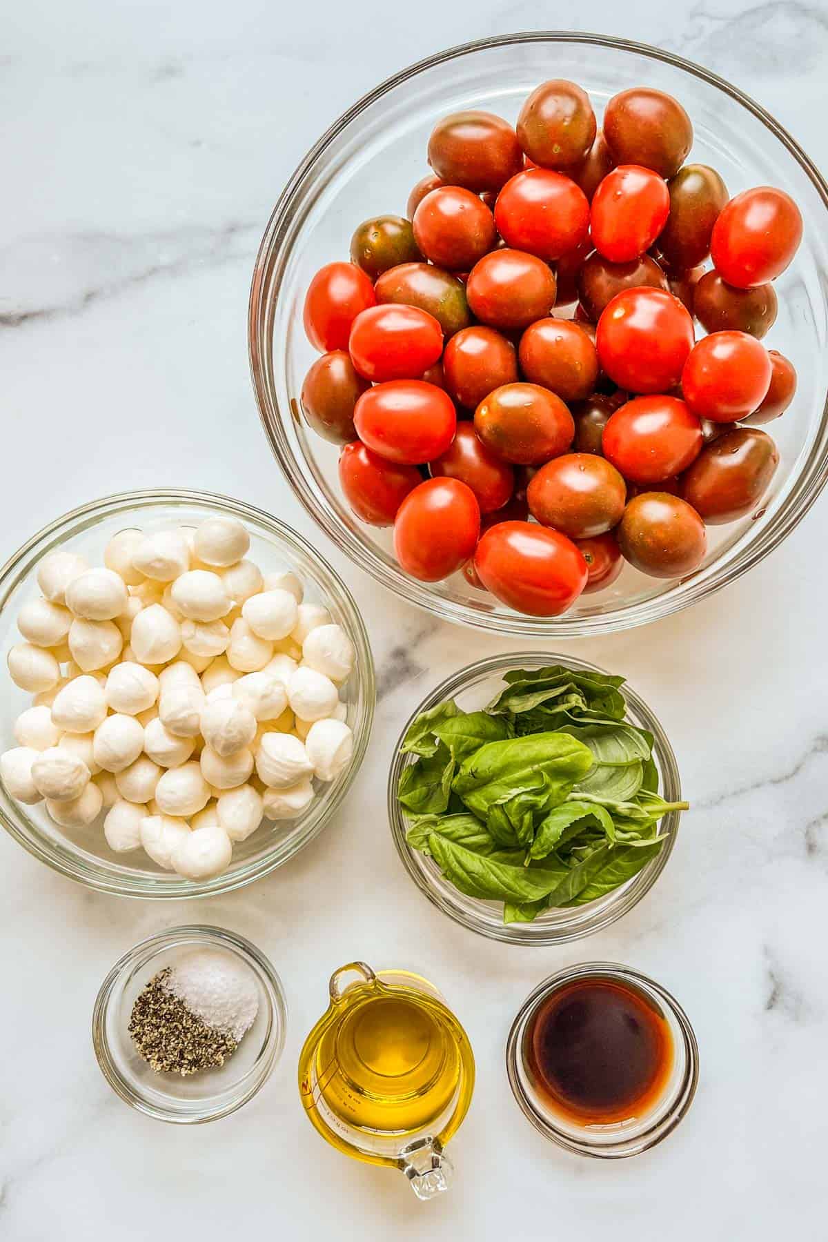 Ingredients for a cherry tomato caprese salad.