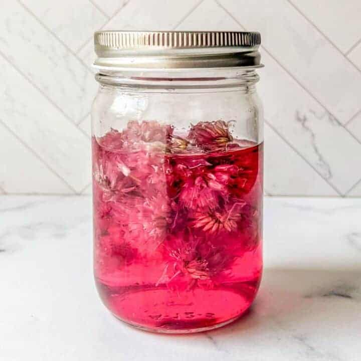 A bottle of chive blossom vinegar.