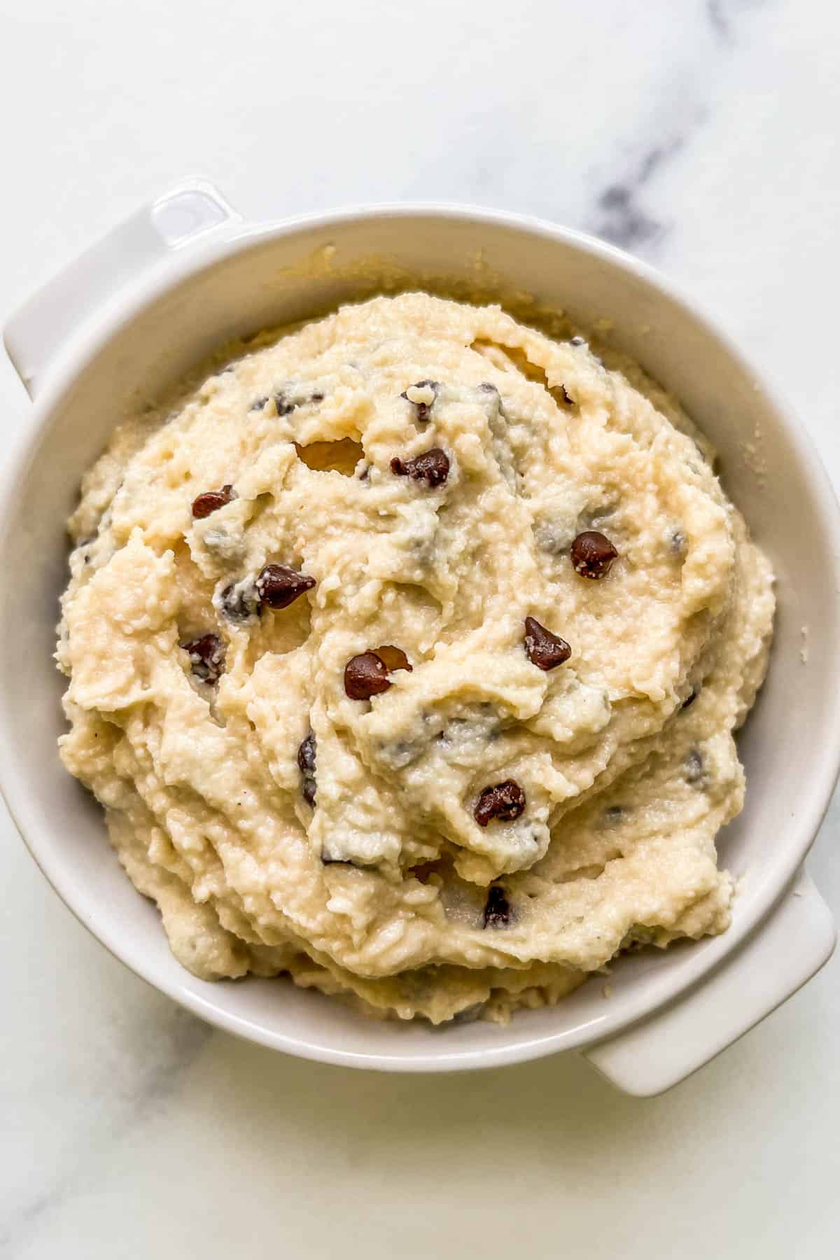 Cottage cheese cookie dough in a white ramekin.