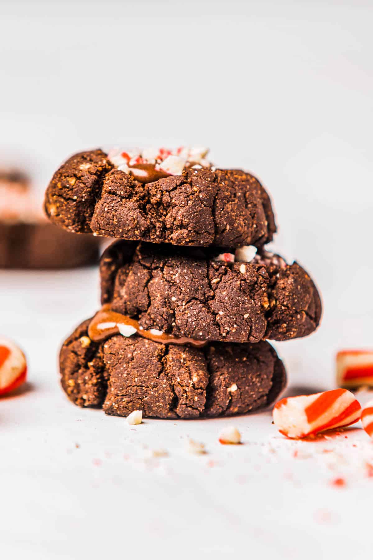 A stack of chocolate thumbprint cookies.