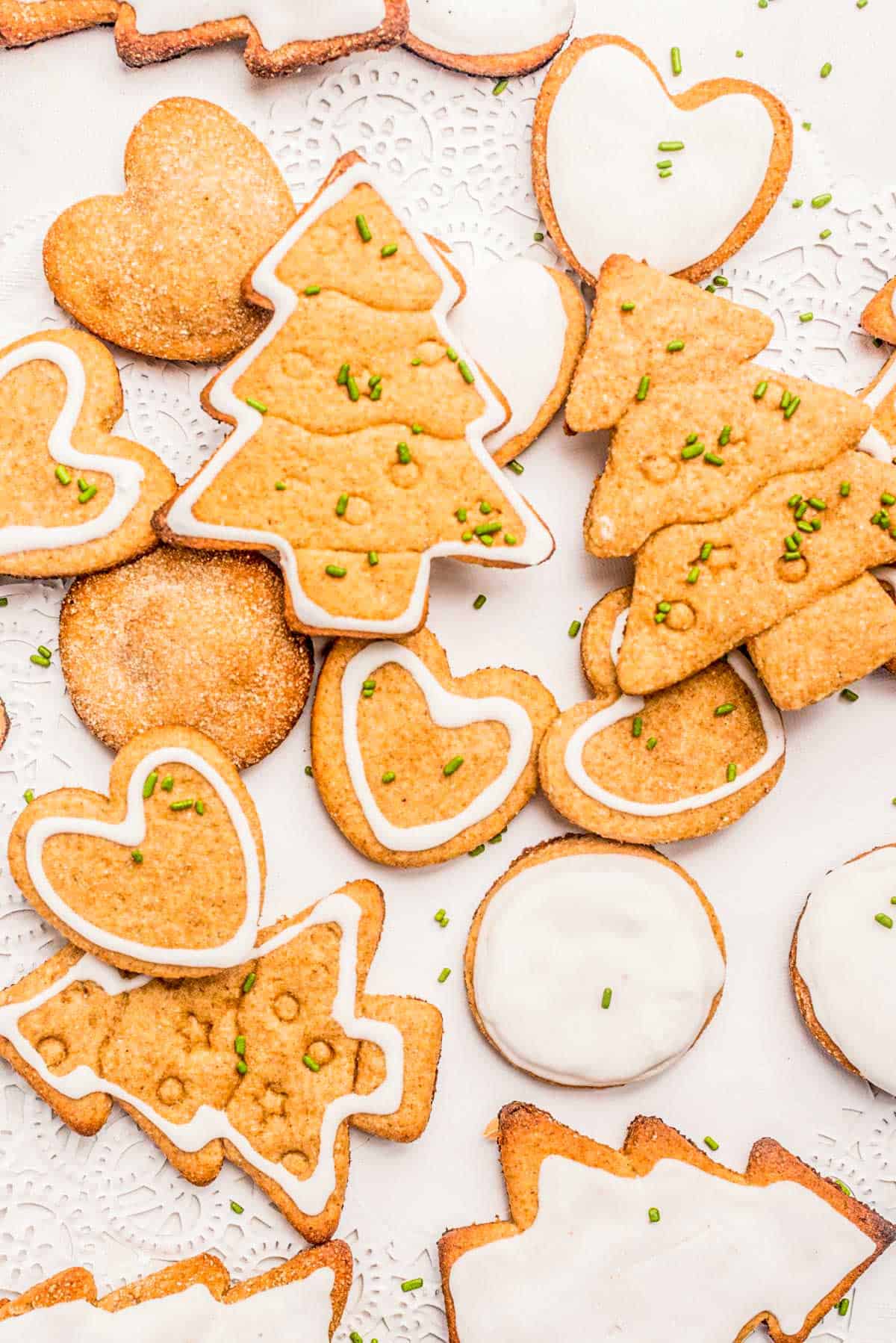 Healthy sugar cookies with white icing and green sprinkles.