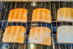 Bread toasting in oven.