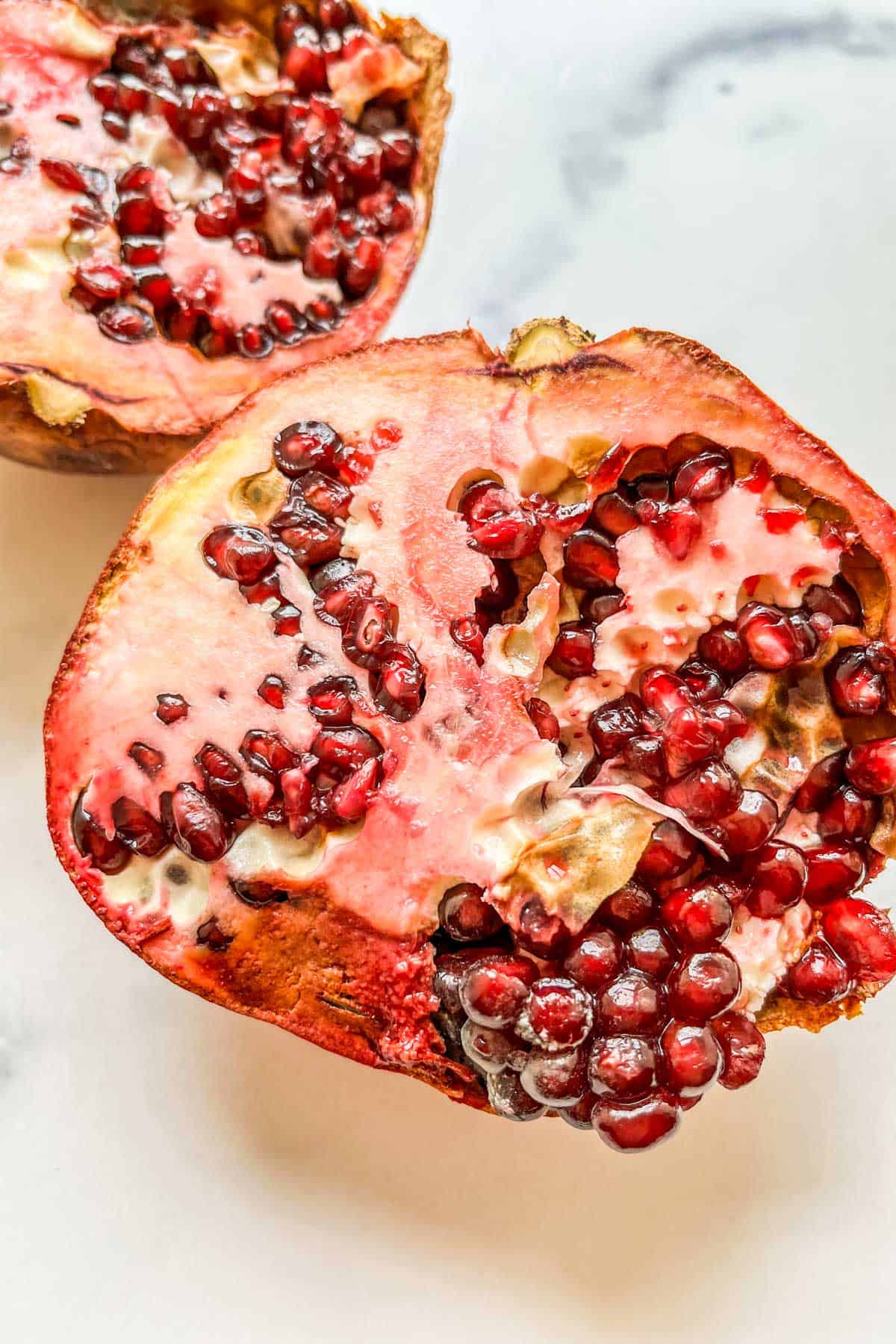 Pomegranate with mold on arils.