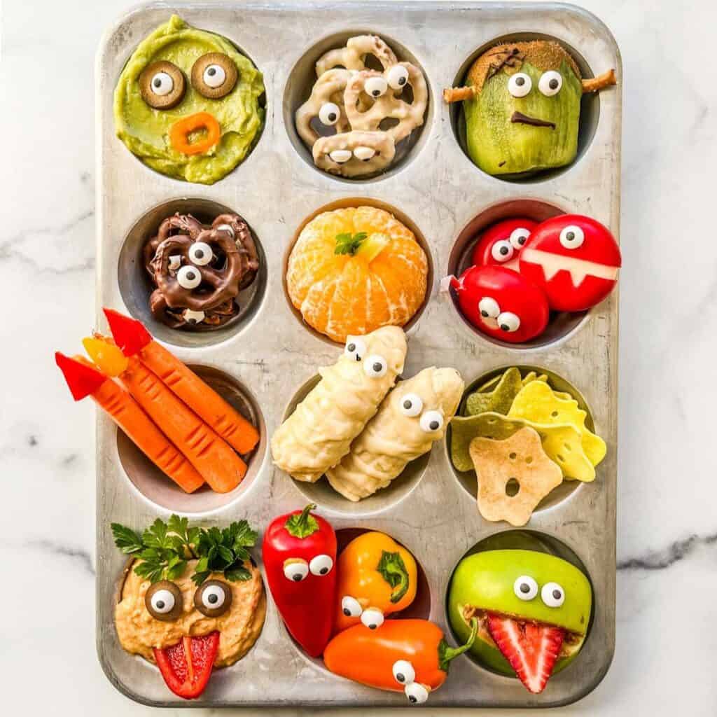 A muffin tin Halloween snack tray.