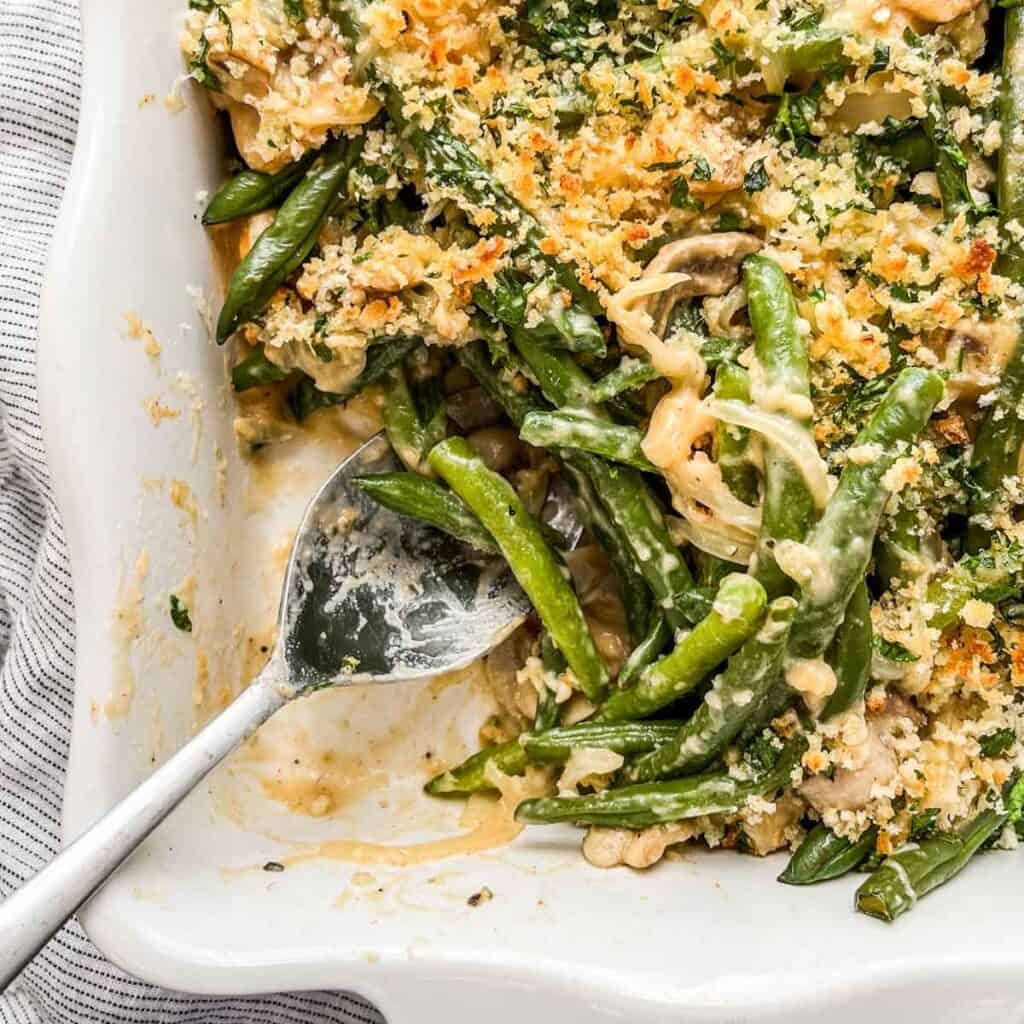 Fresh green bean casserole in a white dish.