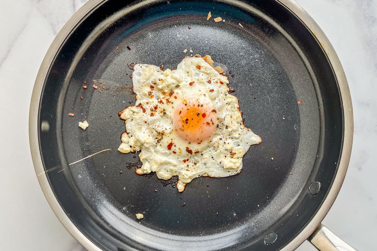 A feta egg in a frying pan.