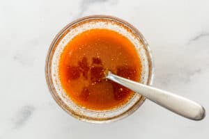 Marinade for the salmon in a small glass bowl.