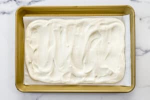 Greek yogurt on a parchment lined sheet pan.