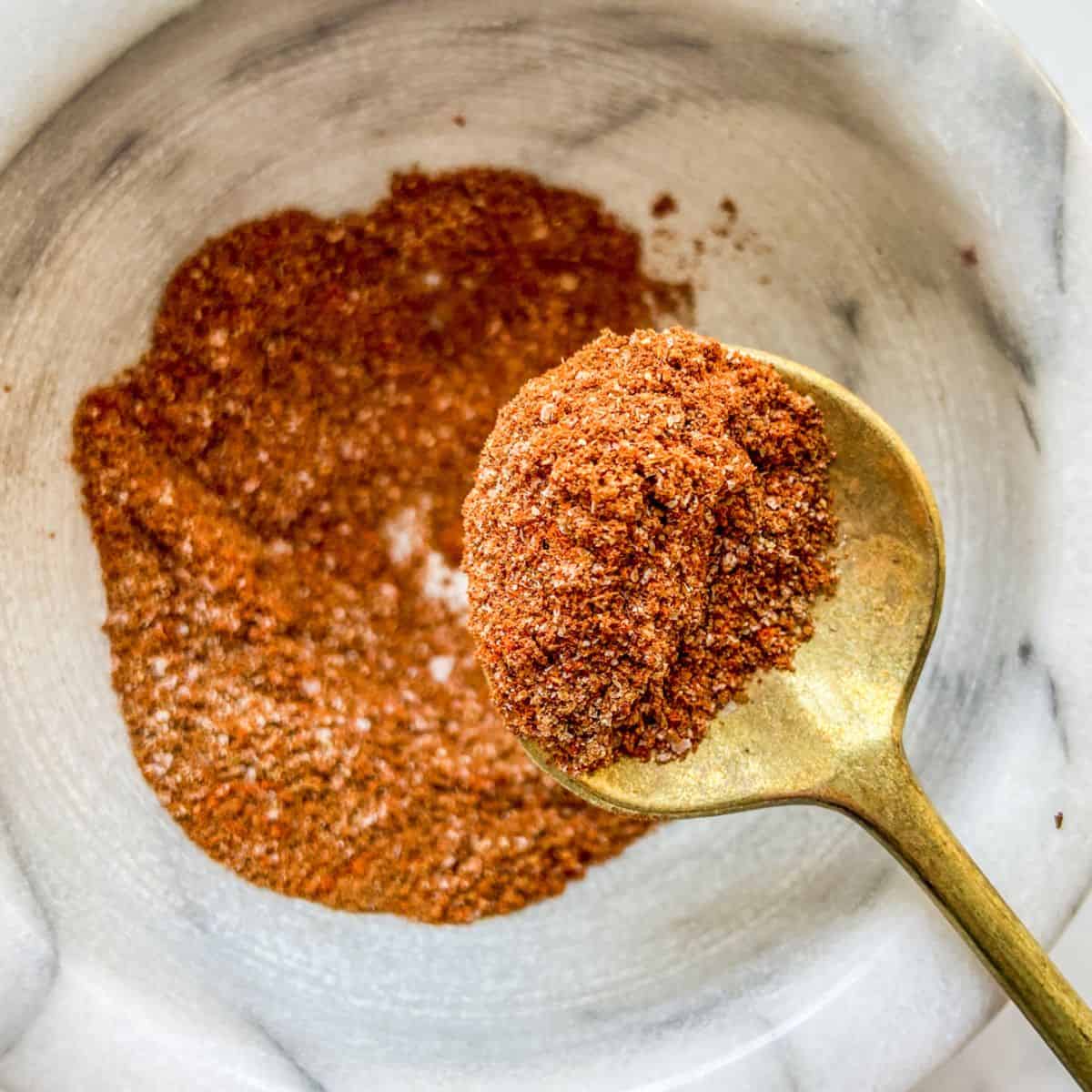 Tagine seasoning on a gold spoon.