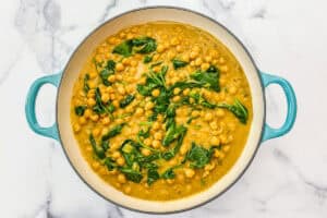 Chickpea curry with spinach stirred in.