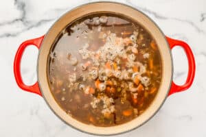 Black bean soup simmering in a pot.