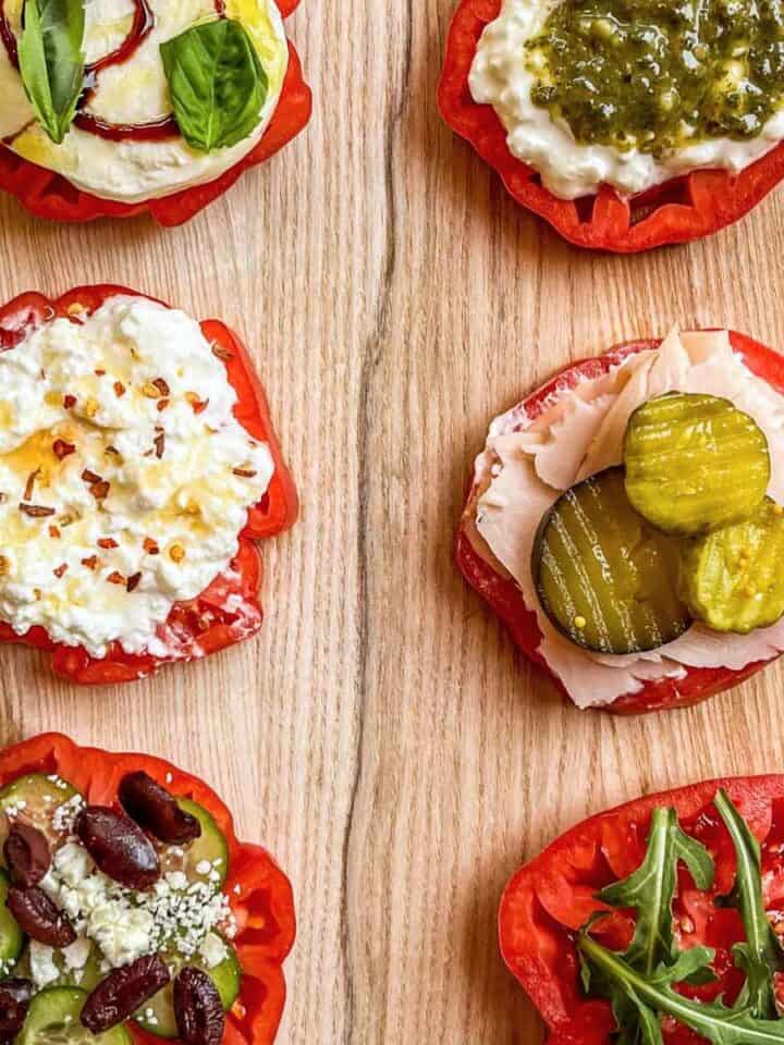 Heirloom tomato flight on a wooden cutting board.