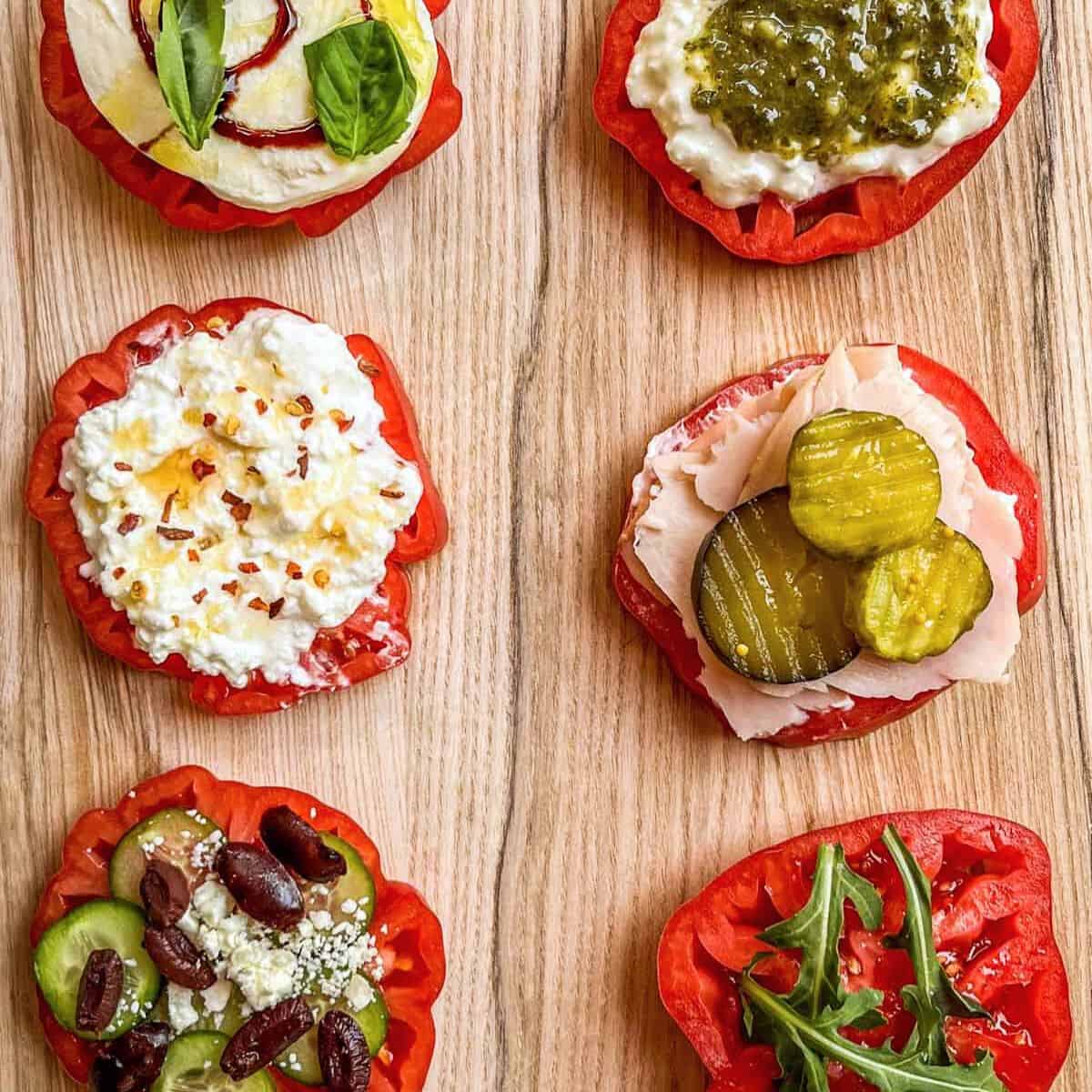 Heirloom tomato flight on a wooden cutting board.