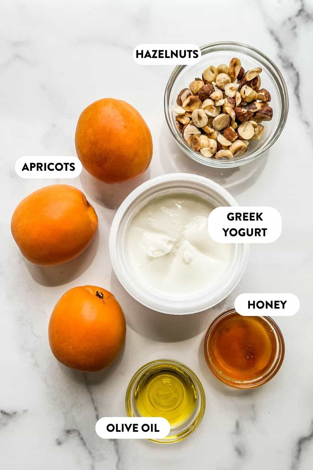 Ingredients for grilled apricots on a marble background.