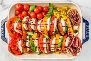 An antipasto caprese salad in a baking dish.
