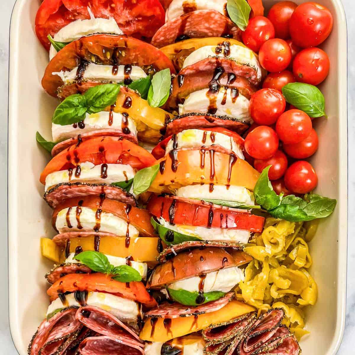 Antipasto caprese salad in a baking dish.