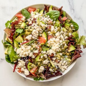 Feta and pepitas added to grapefruit salad.