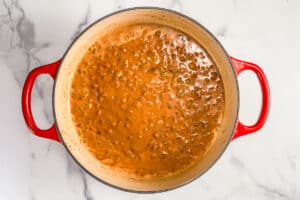 Coconut lentil curry simmering in a pot.