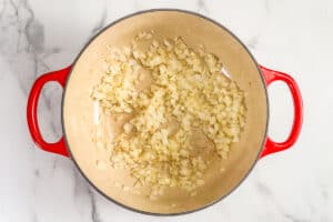Onions and garlic cooked in a pot.