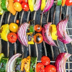 Veggie skewers on grill.