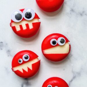 Babybel cheese monsters in a row.