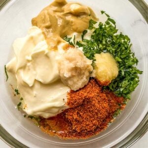 Remoulade ingredients in a glass bowl.