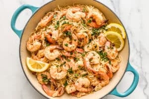 Shrimp seafood pasta with lemon in a pan.
