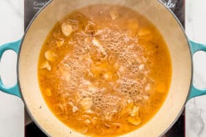 Pasta water added to the shrimp pasta sauce.