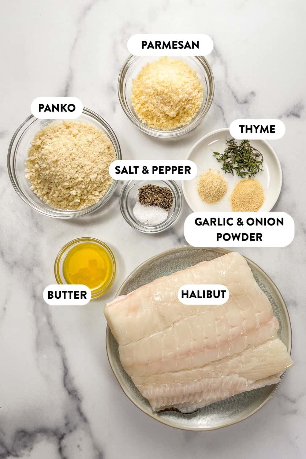 Baked halibut ingredients on a marble background.