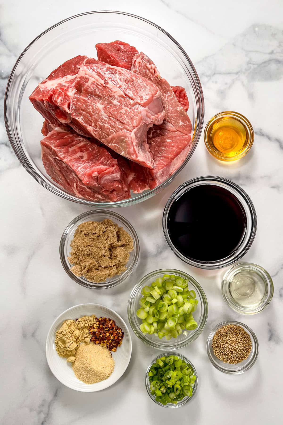Ingredients for slow cooker Korean beef in glass bowls.
