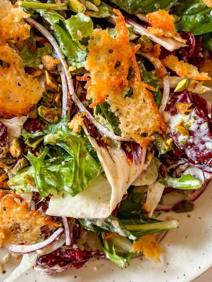 Winter Caesar salad on a white platter.