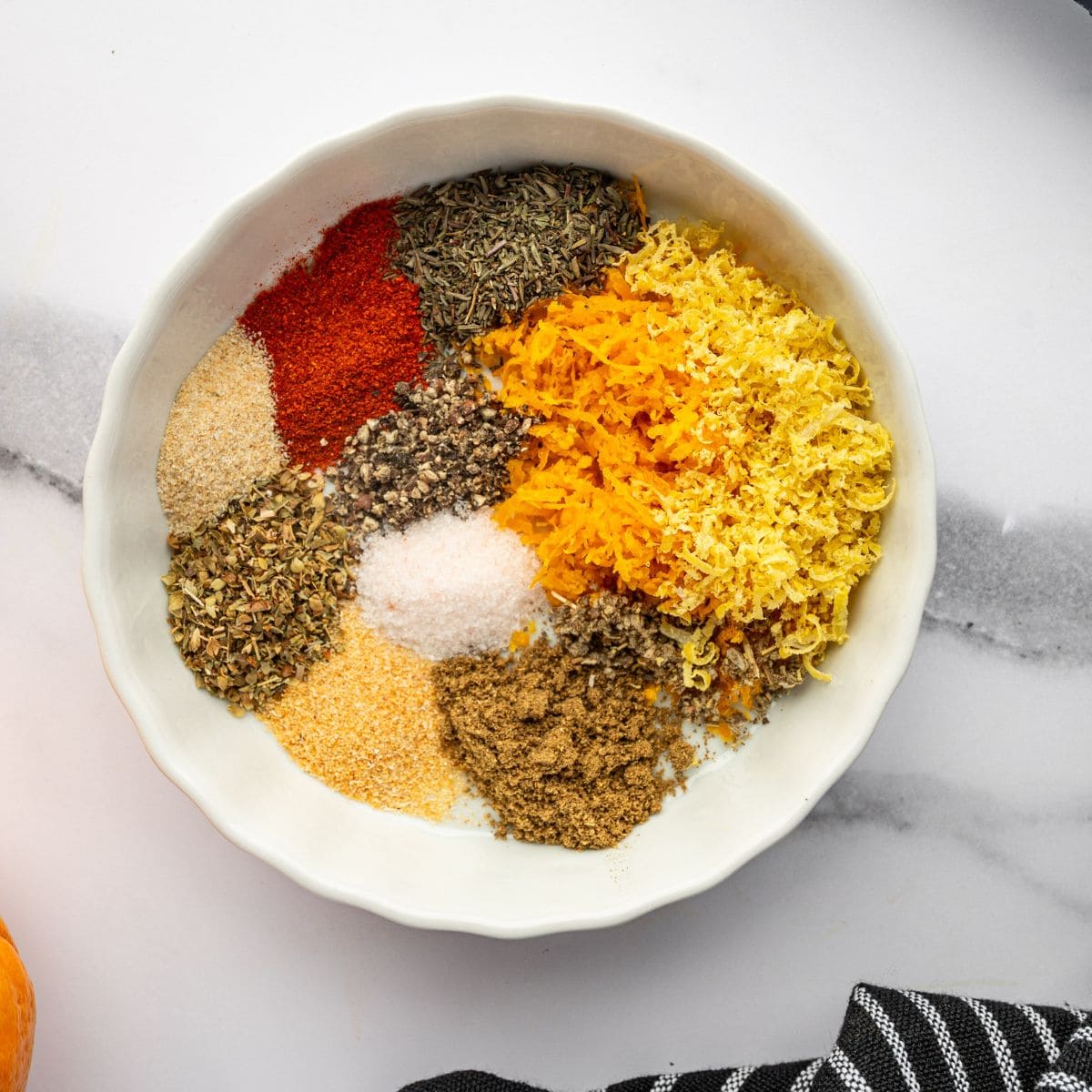 Citrus zest and spices in a bowl.