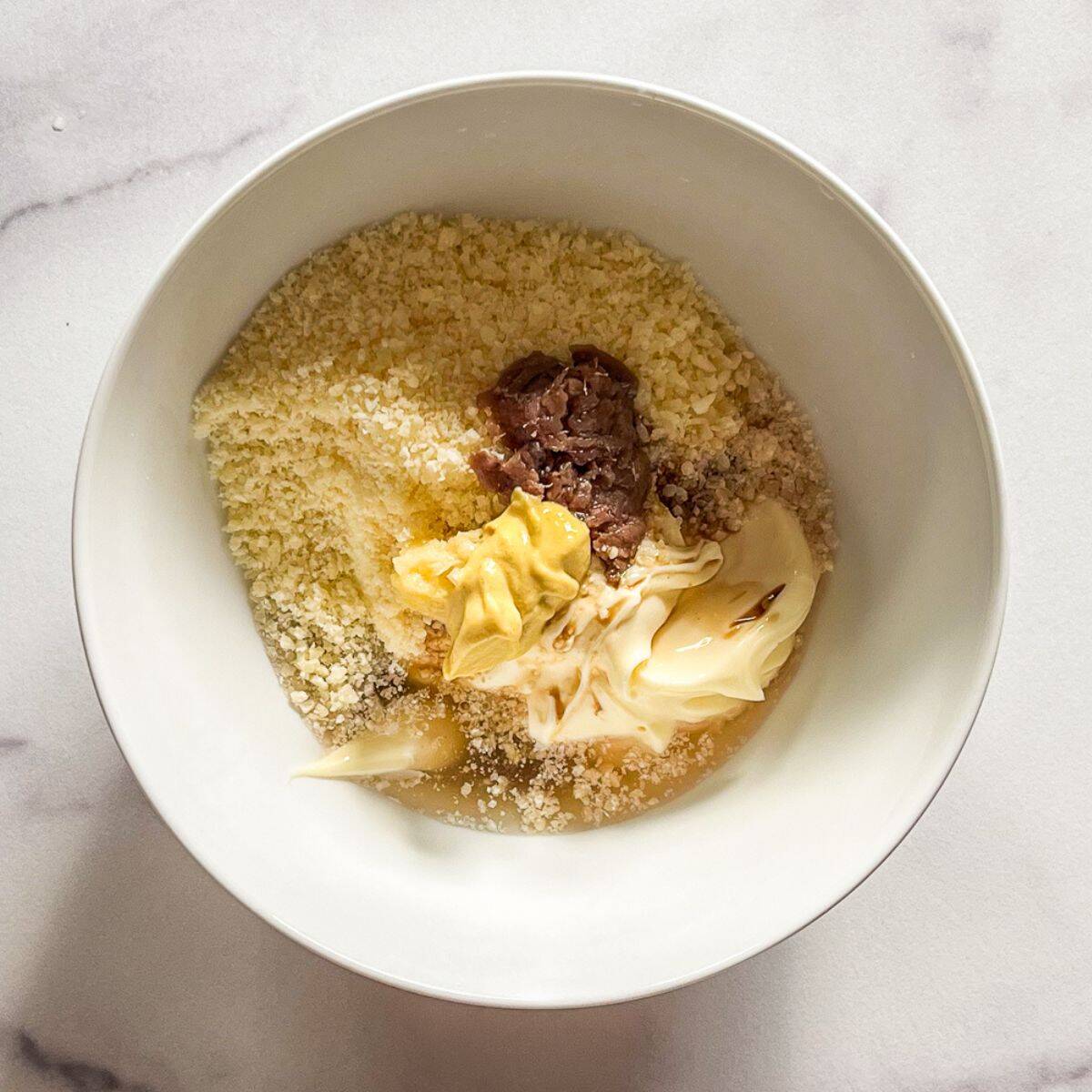 Ingredients for Caesar salad in a bowl.