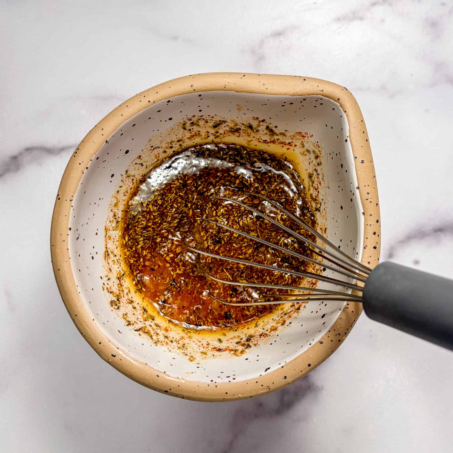 Greek marinade in a small bowl.